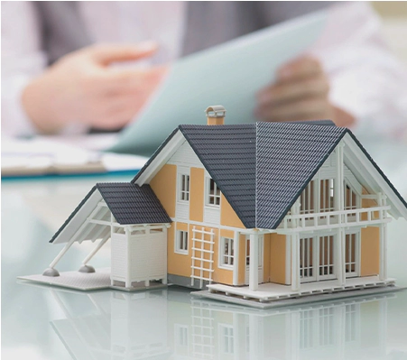 A model of a house sitting on top of a table.