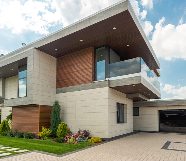 A large modern house with a glass balcony.