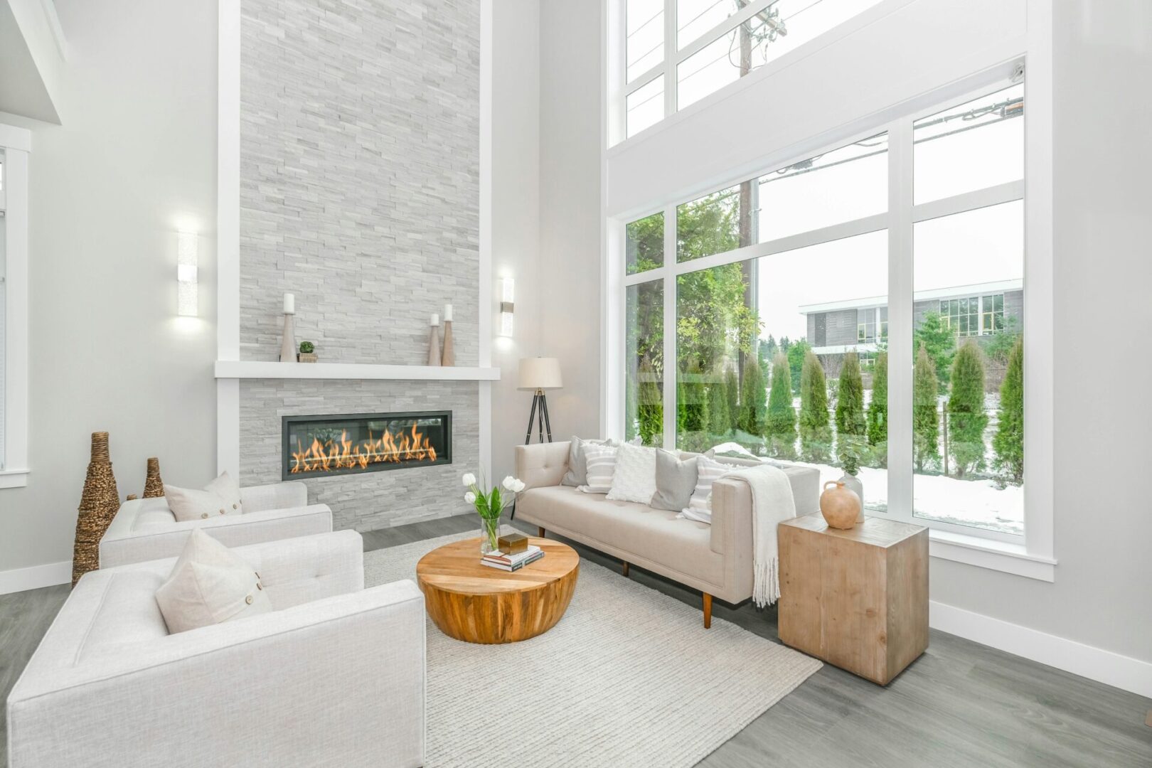 A living room with two couches and a fireplace.